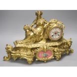 A late 19th century French gilt brass figural mantel clock, Sevres style plaques, length 47cm