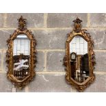 A pair of carved giltwood wall mirrors, width 30cm, height 74cm