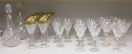 A pair of cut glass silver-mounted decanters and a quantity of cut crystal table glasswareincluding