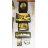 Six Russian Papier mache boxes, each decorated with churches or cathedrals, largest 17 cm