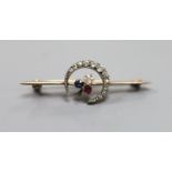 A late Victorian yellow metal, ruby and diamond set crescent and clover bar brooch,42mm, gross 3.3