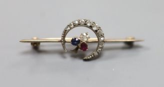 A late Victorian yellow metal, ruby and diamond set crescent and clover bar brooch,42mm, gross 3.3