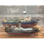 A scale model of the British Railways tug 'Meeching' (Newhaven) and another smaller model of a tug,