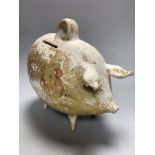 A French earthenware piggy bank, containing coins
