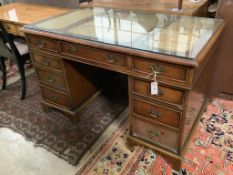 A Georgian style walnut desk with triple skiver, width 123cm depth 72cm height 74cm