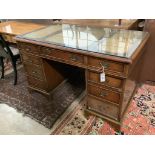 A Georgian style walnut desk with triple skiver, width 123cm depth 72cm height 74cm