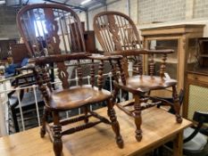 A near pair of 19th century ash and elm Yorkshire Windsor armchairs, larger width 63cm, depth 48cm,