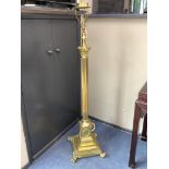 An early 20th century adjustable brass corinthian column lamp standard, minimum height 150cm