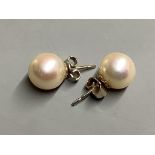 A pair of white metal and cultured pearl stud earrings.