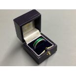 A Garrard's modern silver and green enamel band,size O.