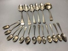A collection of Georgian silver Old English pattern flatware,comprising five tablespoons, a sauce