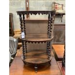 A Victorian rosewood oval three tier whatnot, width 48cm, depth 34cm, height 81cm