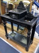 A late Victorian ebonised oak hallstand carved in Flemish style, length 77cm, depth 32cm, height