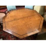 A Regency oak and ebony line inlaid octagonal topped breakfast table, width 138cm, height 72cmBy