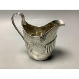 A George III part fluted silver oval cream jug, maker's mark rubbed, London, 1798, height 12.5cm,