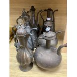 Seven Arabic tinned copper coffee pots, tallest being 34cm high