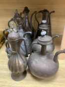 Seven Arabic tinned copper coffee pots, tallest being 34cm high