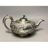 A Victorian embossed silver squat melon shaped teapot, Walter Morrise, London, 1846, height 14.1cm,