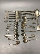 A small collection of silver fiddle pattern flatware, two pairs of sugar tongs and sundry silver