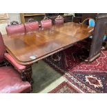 A Victorian mahogany extending dining tablewith moulded top rounded corners, on turned heavy reeded