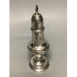 A George III silver baluster caster, with later embossed decoration, Thomas Shepherd, London, 1785,