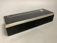 An Art Deco black enamel and chrome cigarette box