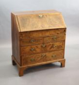 An early 18th century small walnut and crossbanded bureau, width 84cm, depth 46cm, height 98cm