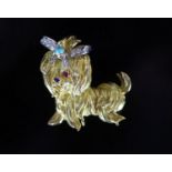 A 20th century gold, sapphire, ruby, turquoise and diamond set terrier brooch,height 35mm, gross