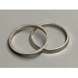 Two platinum wedding rings, both size P, 5.5 grams.