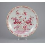 An unusual Chinese export famille rose dish, Yongzheng/Qianlong period,painted with flowers and