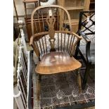 An early 20th century elm and beech Windsor comb back elbow chair, width 52cm, depth 50cm, height