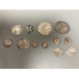 A group of Elizabeth I silver coins - two shillings, 1584 and 1575 sixpences, 1561 and 1569