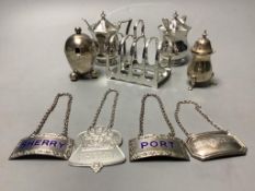 A pair of octagonal silver mustard pots and spoons, an egg-shaped salt, a baluster pepper, a small