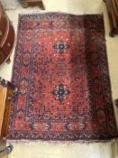 An African red ground rug, 142 x 103cm