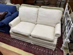 A Wesley Barrell cream fabric metal action two seater sofa bed, width 160cm, depth 96cm, height