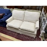 A Wesley Barrell cream fabric metal action two seater sofa bed, width 160cm, depth 96cm, height