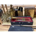 A quantity of mixed brass including a coal scuttle, trivets, a jardiniere, lighting and a trumpet,