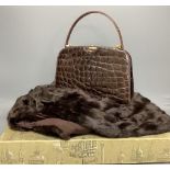 A Russell & Bromley brown crocodile effect handbag (made in France), a blond mink stole in Harrods