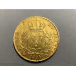 A French 20 Franc gold coin, 1814, Louis XVIII bare head to obverse, crowned wreath to reverse