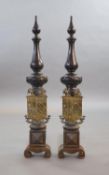 A substantial pair of 19th century heraldic cast iron fire dogs,with pointed baluster finals above