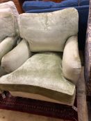 A George Smith Howard style armchair upholstered in pale green velvet, width 80cm, depth 110cm,