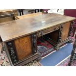 A large late 19th century oak and walnut kneehole desk, width 180cm depth 91cm height 78cm