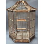 An hexagonal wood birdcage