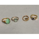 A yellow metal (stamped 14k) and green cabochon set ring, size N, gross 3.7 grams, a 9ct ring and