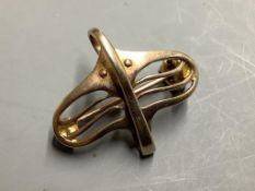 An early 20th century 9ct yellow gold brooch in the form of a stylised bird, by Murrle Bennett &