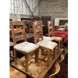 A set of four rush seated dining chairs
