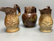 Two 19th century hunting related stoneware jugs and a Doulton Lambeth Autumn leaves stoneware jug,