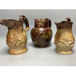 Two 19th century hunting related stoneware jugs and a Doulton Lambeth Autumn leaves stoneware jug,
