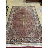 A North West Persian style peach ground carpet, 300 x 206cm