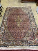 A North West Persian style peach ground carpet, 300 x 206cm